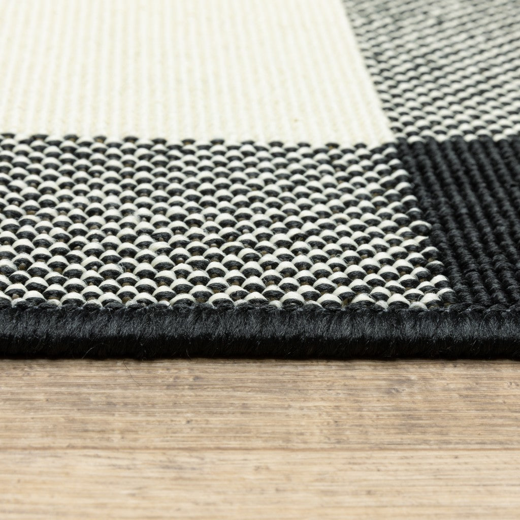 HomeRoots Polypropylene 8’ Round Black and Ivory Gingham Indoor Outdoor Area Rug