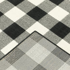 HomeRoots Polypropylene 9’x13’ Black and Ivory Gingham Indoor Outdoor Area Rug