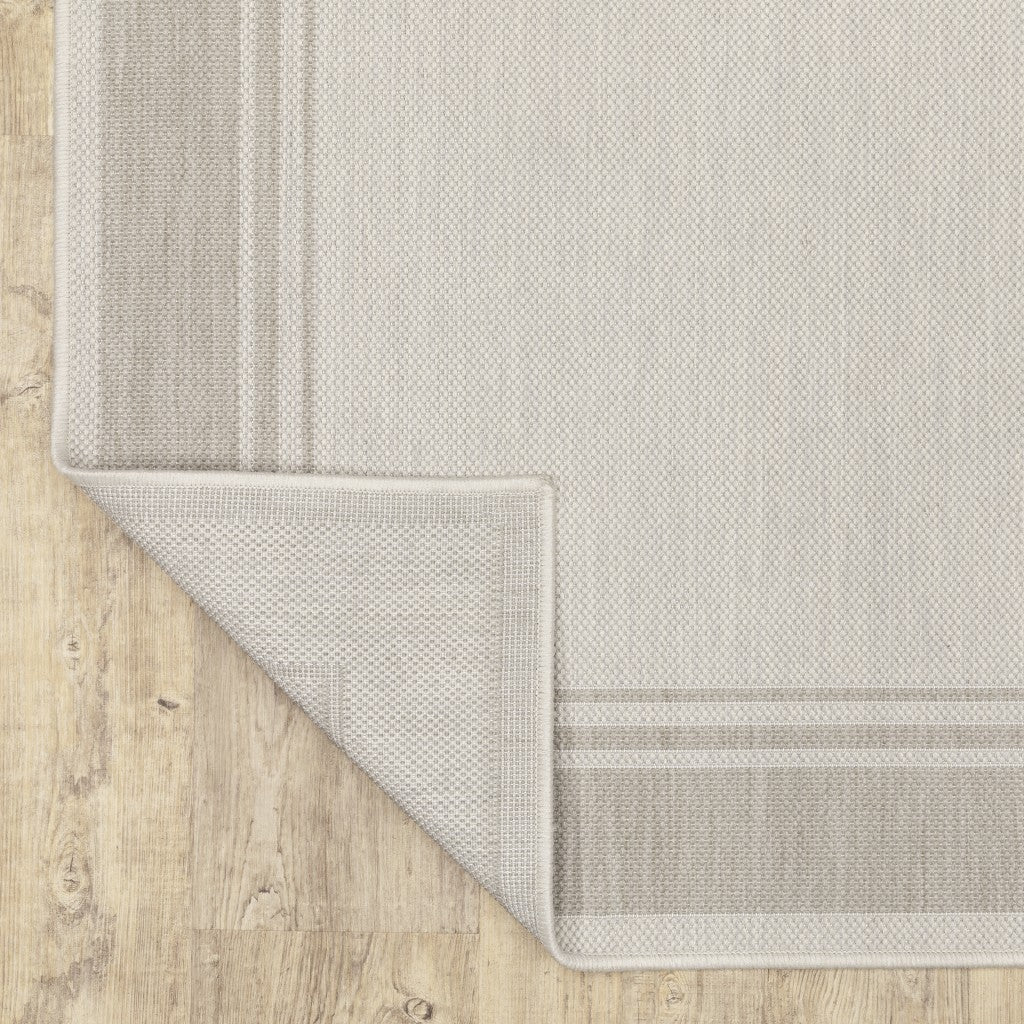HomeRoots Polypropylene 8’x10’ Ivory and Gray Bordered Indoor Outdoor Area Rug