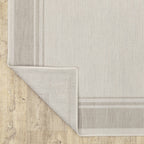 HomeRoots Polypropylene 8’x10’ Ivory and Gray Bordered Indoor Outdoor Area Rug