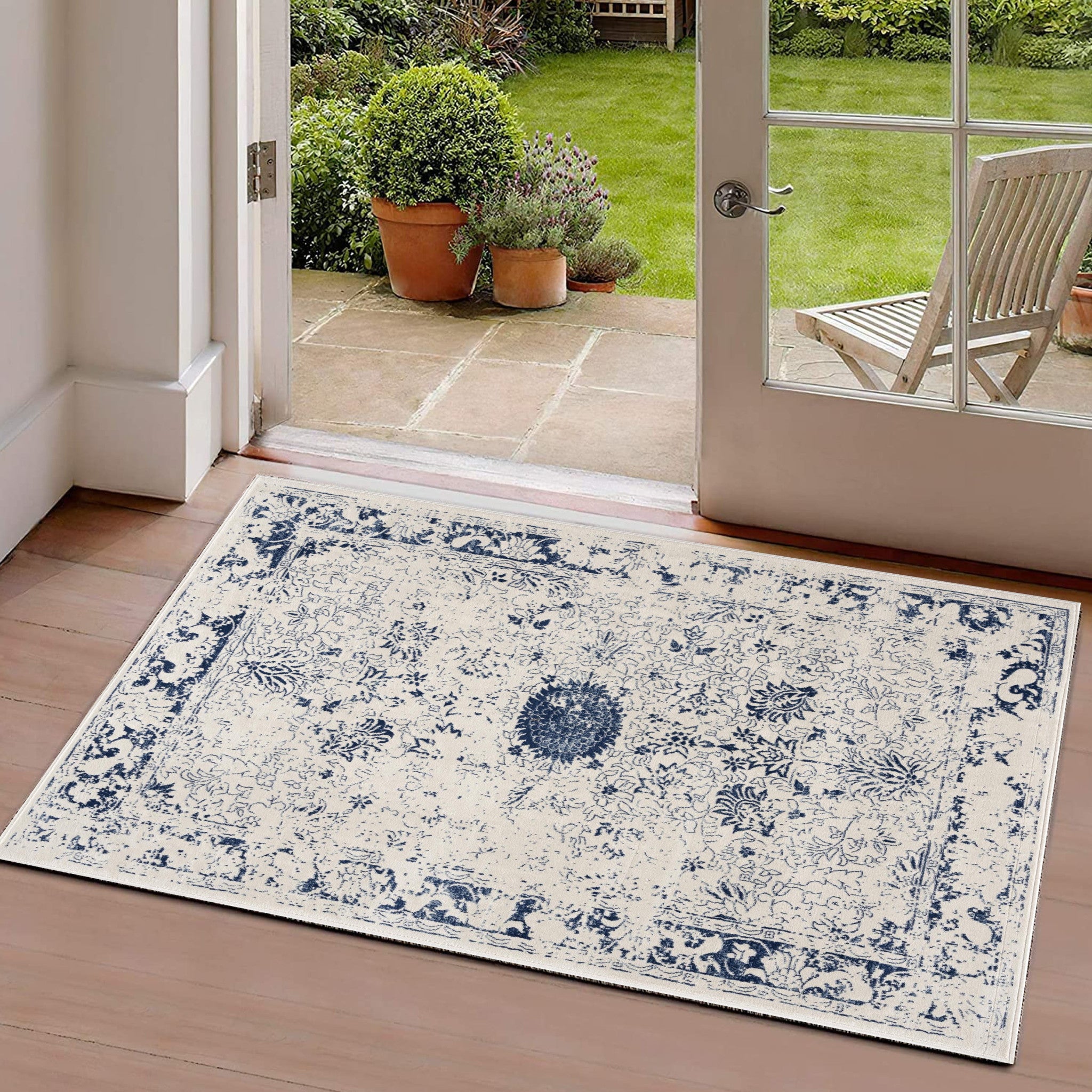 HomeRoots 100% Polypropylene 2’ x 3’ Navy Blue Distressed Floral Scatter Rug