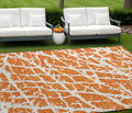 8' X 10' Orange And White Abstract Washable Non Skid Indoor Outdoor Area Rug