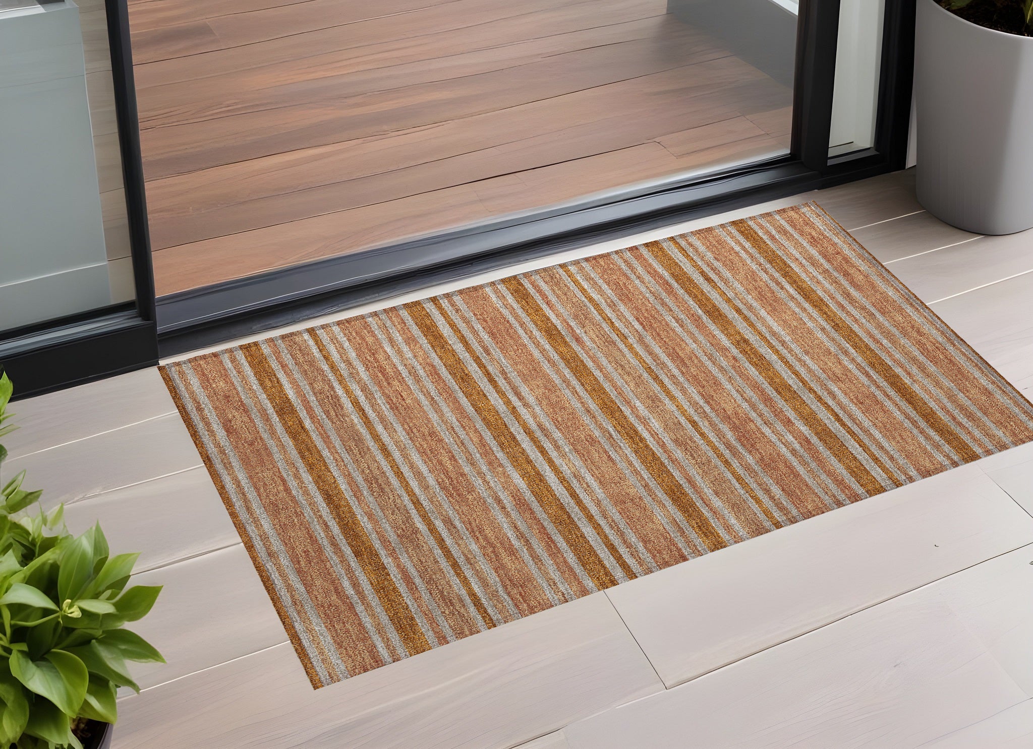 2' X 3' Beige And Orange Striped Washable Non Skid Indoor Outdoor Area Rug