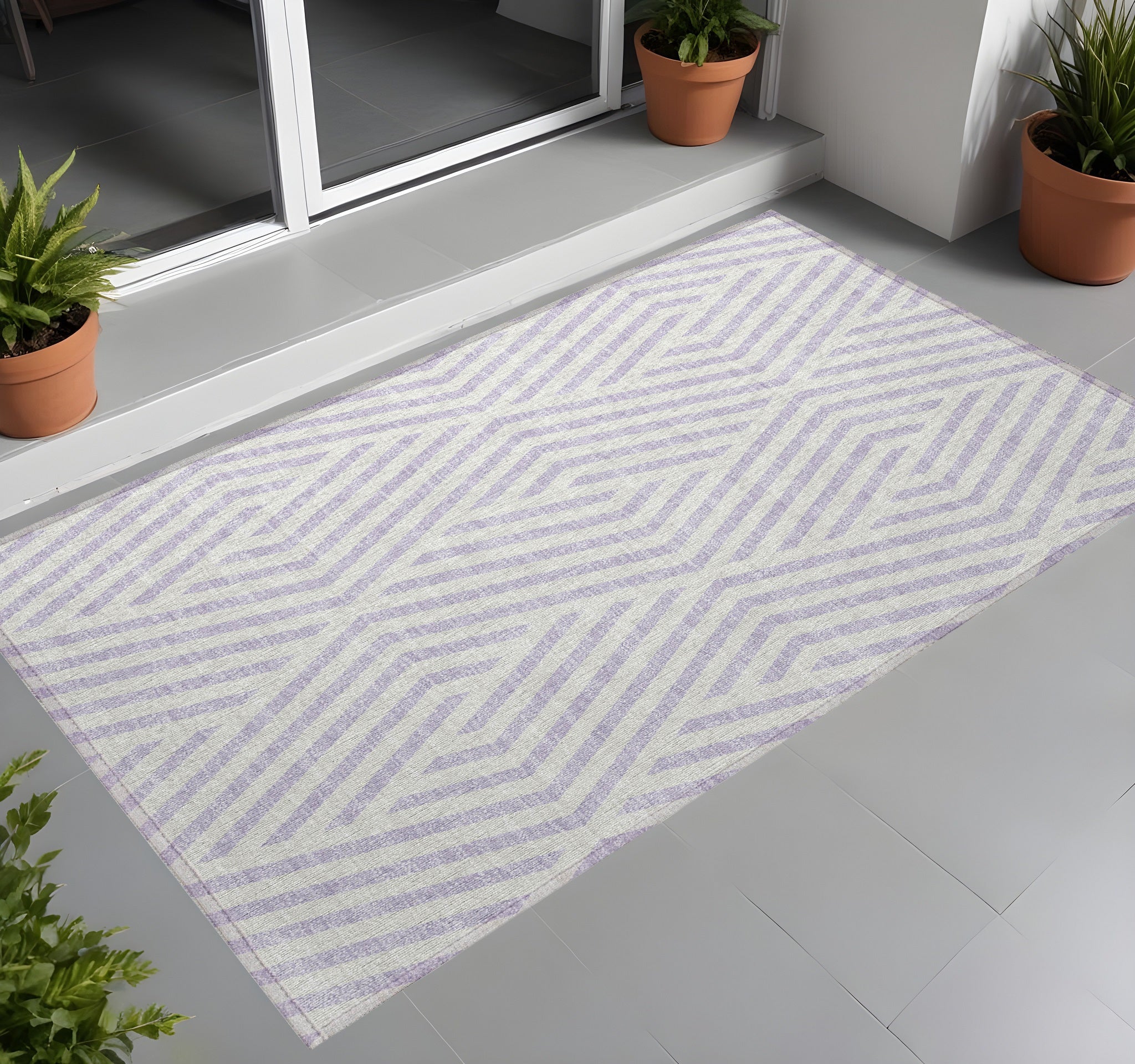 2' X 3' Lavender And Ivory Geometric Washable Non Skid Indoor Outdoor Area Rug