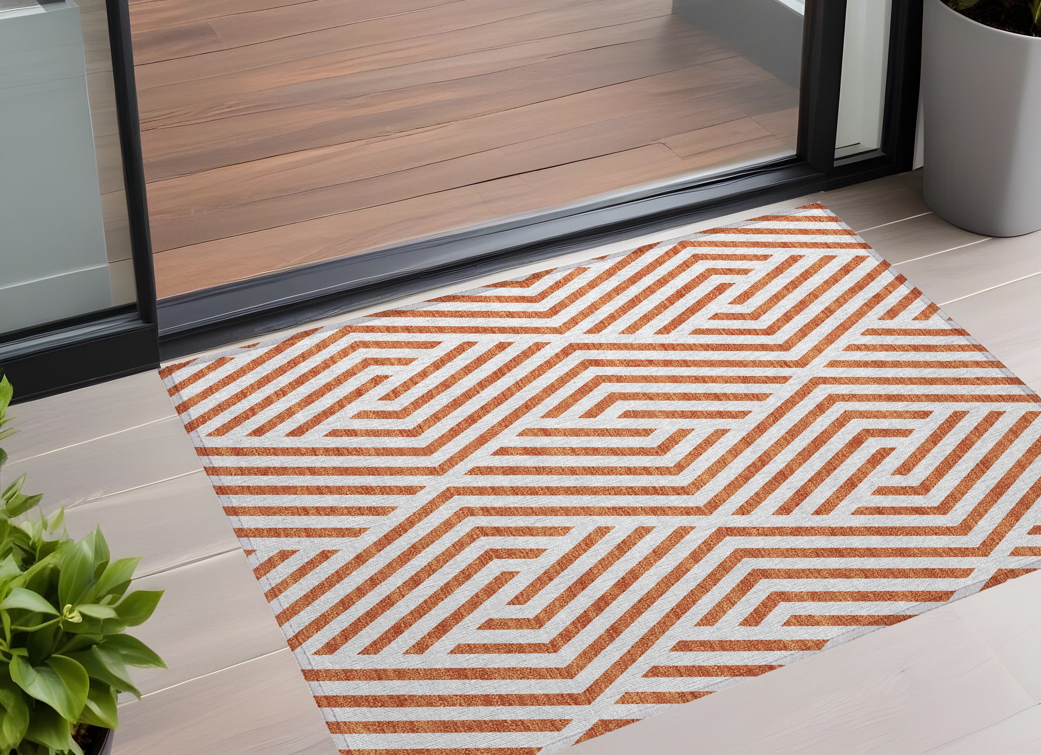 2' X 3' Orange And White Geometric Washable Non Skid Indoor Outdoor Area Rug
