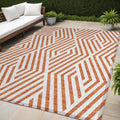 5' X 8' Orange And White Geometric Washable Non Skid Indoor Outdoor Area Rug
