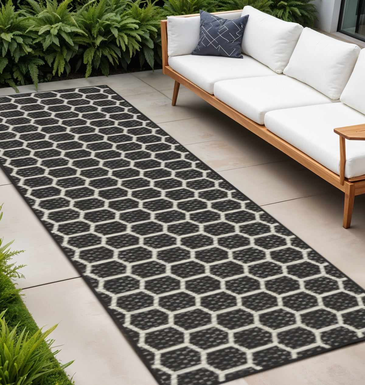 8 Black And Ivory Geometric Indoor Outdoor Runner Rug