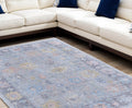 10' X 14' Orange Blue and Gold Floral Hand Woven Distressed Area Rug With Fringe