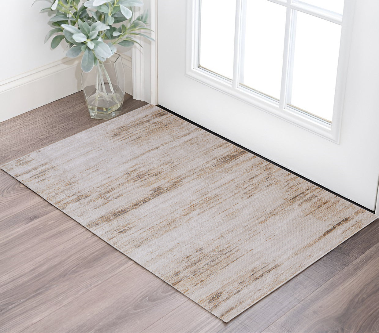 2' X 3' Ivory and Tan Abstract Power Loom Worn Faded Area Rug