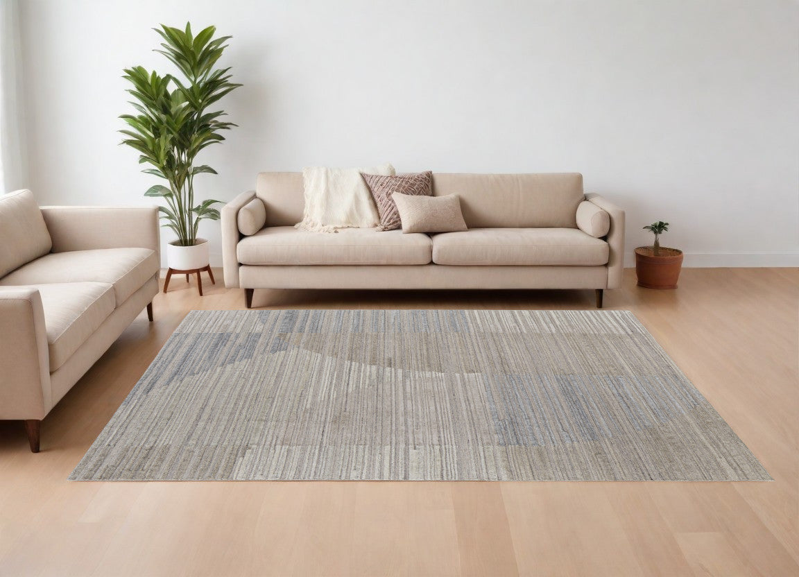 8' X 10' Tan and Blue Abstract Hand Woven Worn Faded Area Rug