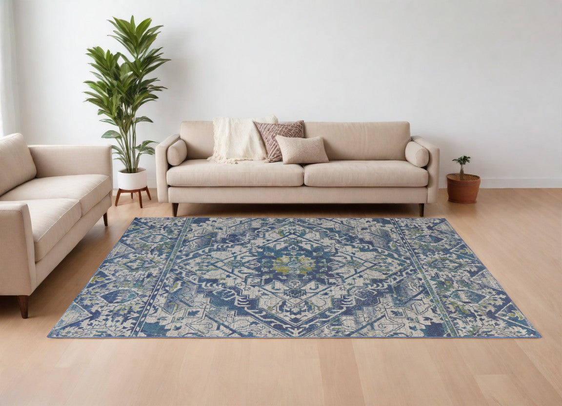 6' X 9' Green Blue and Ivory Oriental Power Loom Area Rug