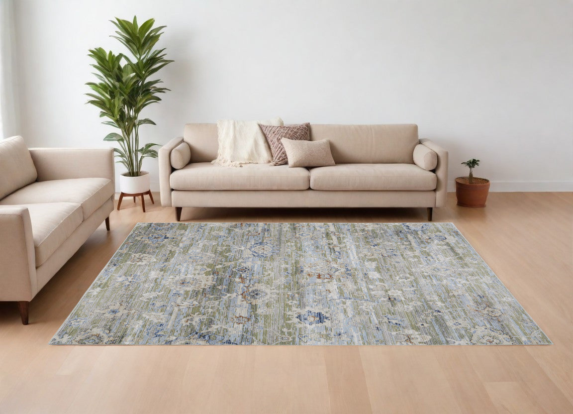 8' X 10' Ivory Green and Blue Floral Power Loom Worn Faded Area Rug