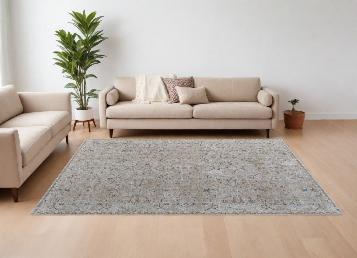 8' X 10' Ivory Taupe and Blue Abstract Power Loom Worn Faded Area Rug With Fringe