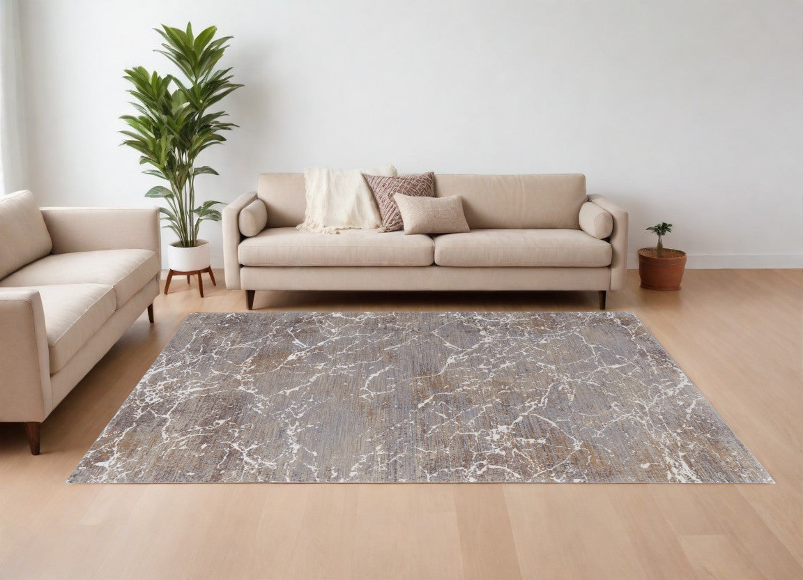 7' X 10' Ivory Brown and Taupe Abstract Power Loom Area Rug
