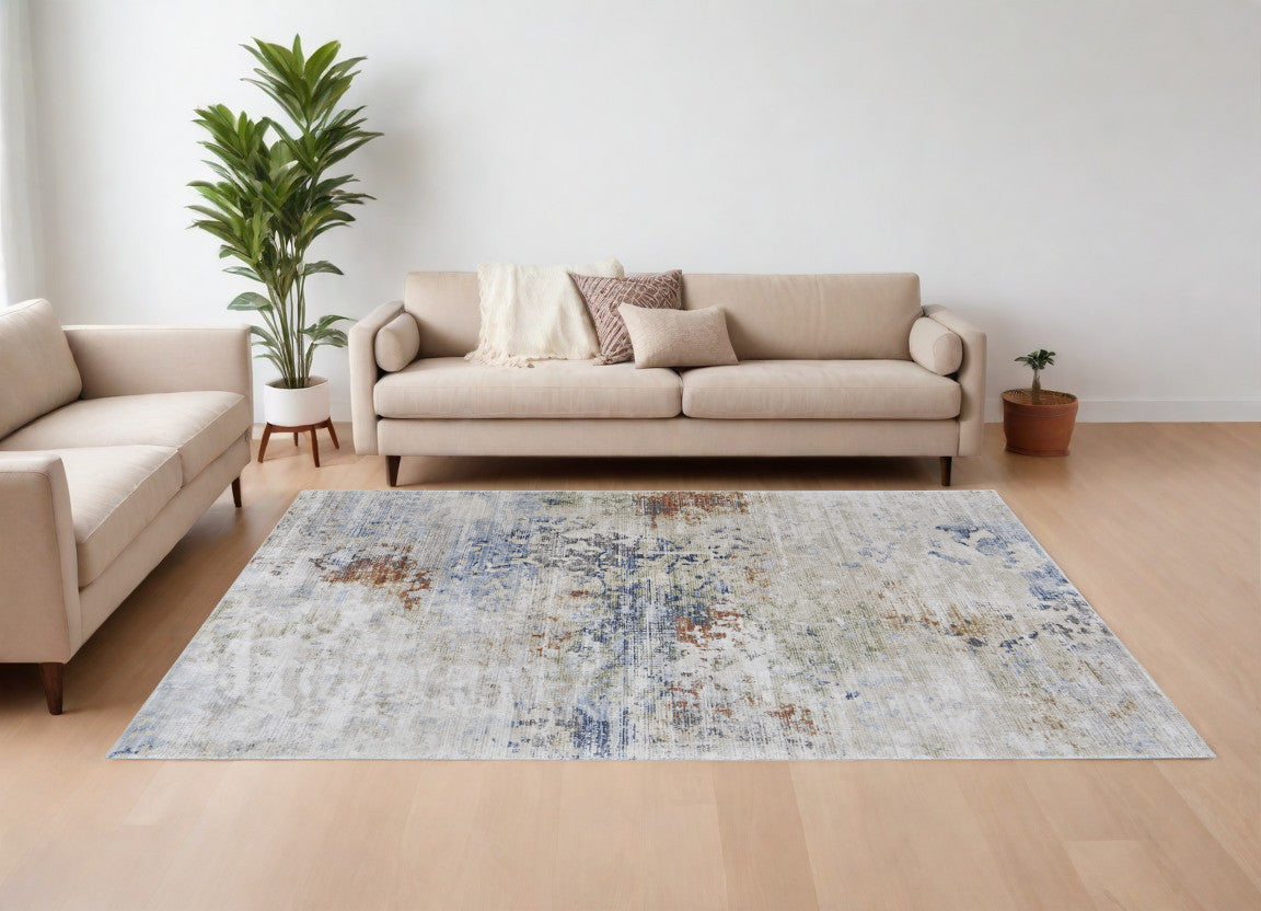 8' X 10' Red Blue and Ivory Abstract Power Loom Area Rug