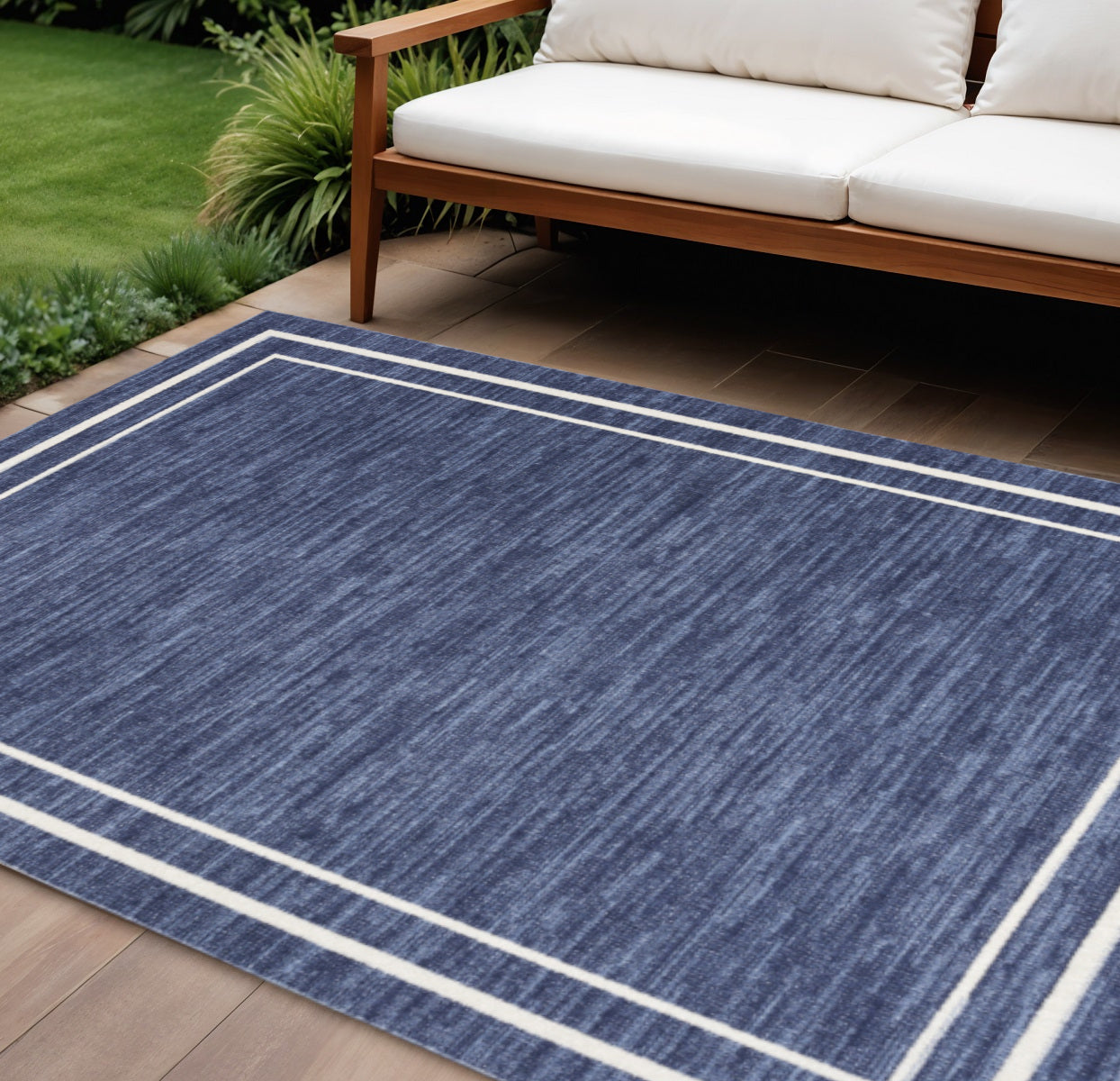 7 X 10 Navy Blue And Ivory Indoor Outdoor Area Rug