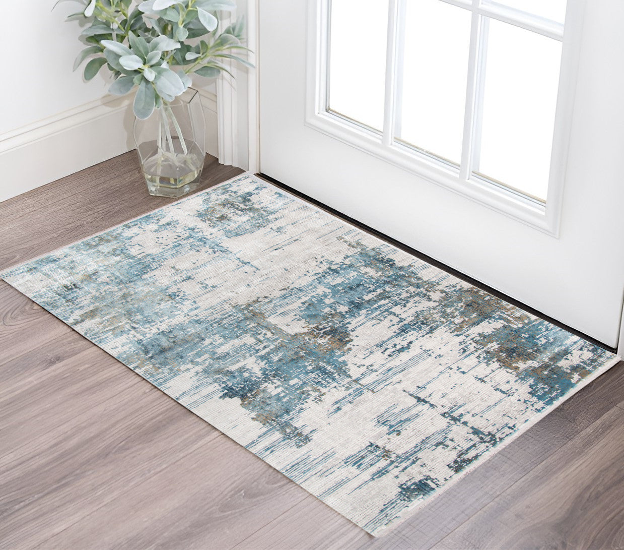 2 X 3 Ivory Blue And Brown Abstract Area Rug With Fringe