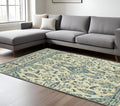 7' X 10' Ivory And Blue Oriental Area Rug With Fringe