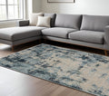 7' X 10' Beige And Blue Abstract Distressed Area Rug With Fringe