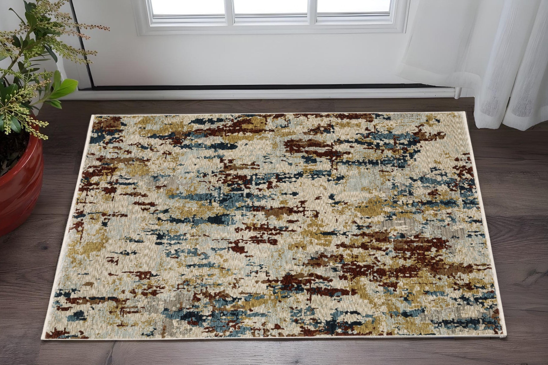 3' X 5' Beige Rust And Tan Abstract Area Rug With Fringe