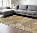 8' X 11' Beige And Gold Abstract Area Rug With Fringe