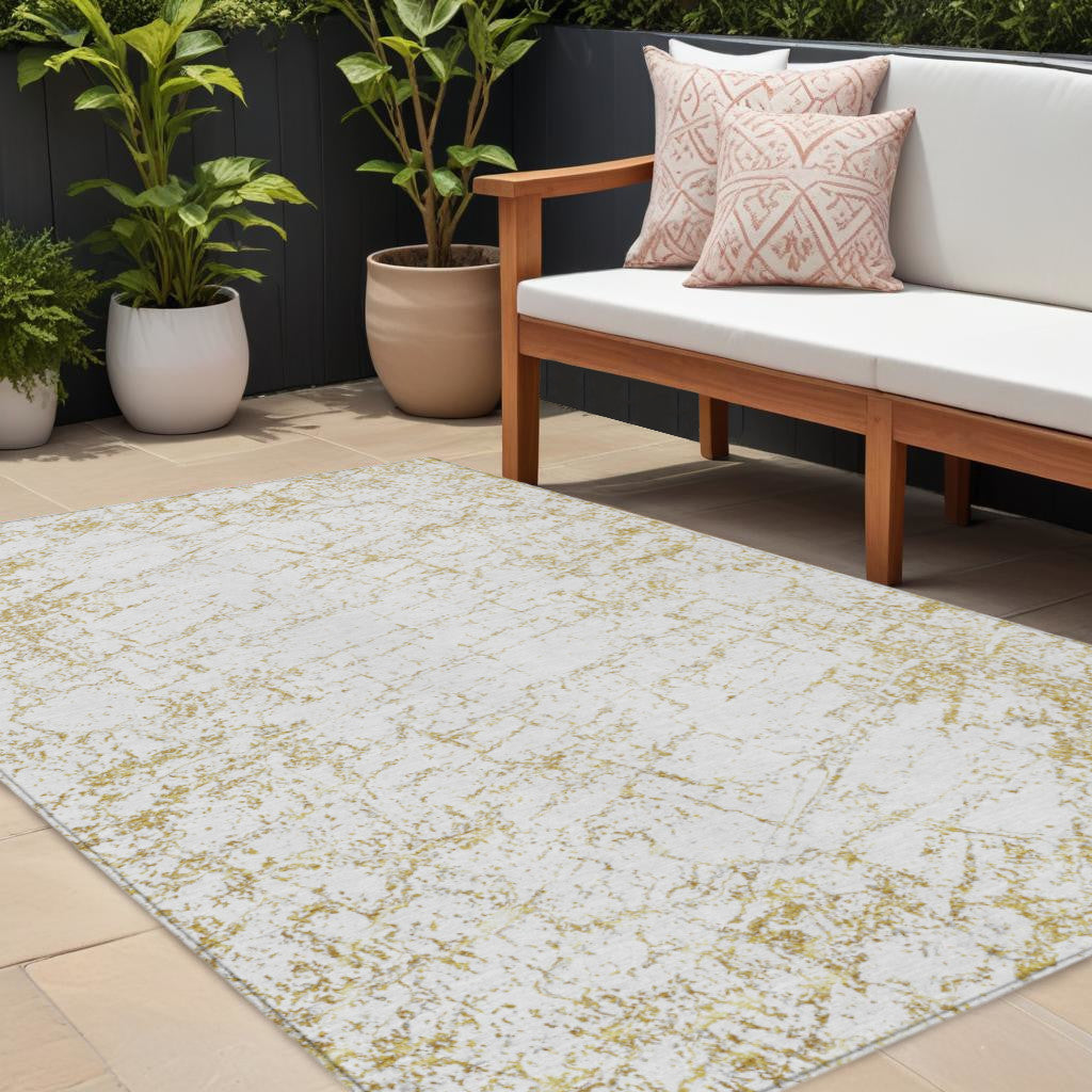 10' X 14' Gold And Ivory Abstract Washable Indoor Outdoor Area Rug