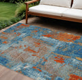 10' X 14' Navy Blue Orange And Ivory Abstract Washable Indoor Outdoor Area Rug