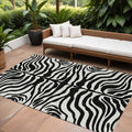 9' X 12' Black And Ivory Animal Print Washable Indoor Outdoor Area Rug