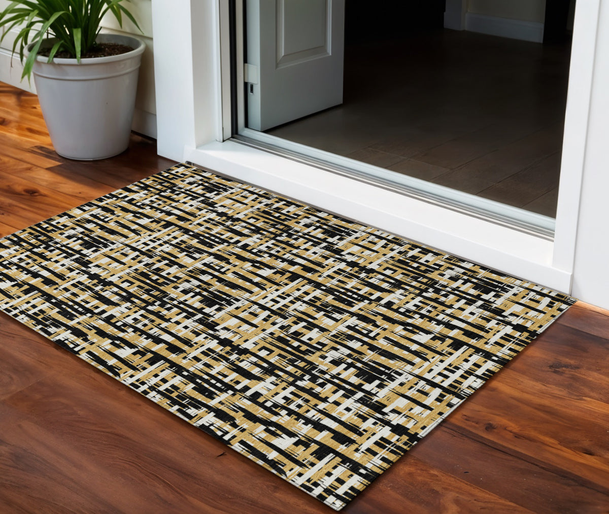 3' X 5' Black Gold And Ivory Abstract Washable Indoor Outdoor Area Rug