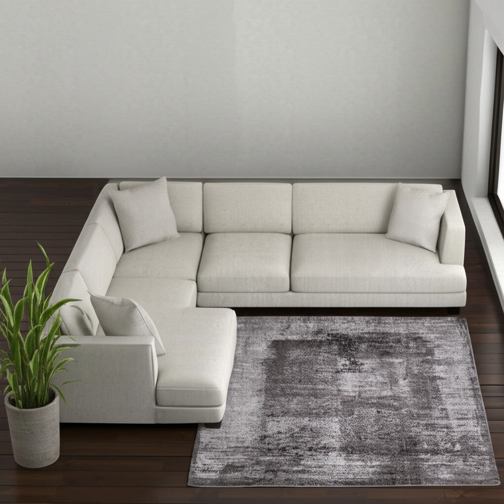 7' X 10' Gray Black And Taupe Abstract Distressed Area Rug