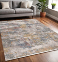 5 X 8 Cream Blue And Yellow Abstract Area Rug