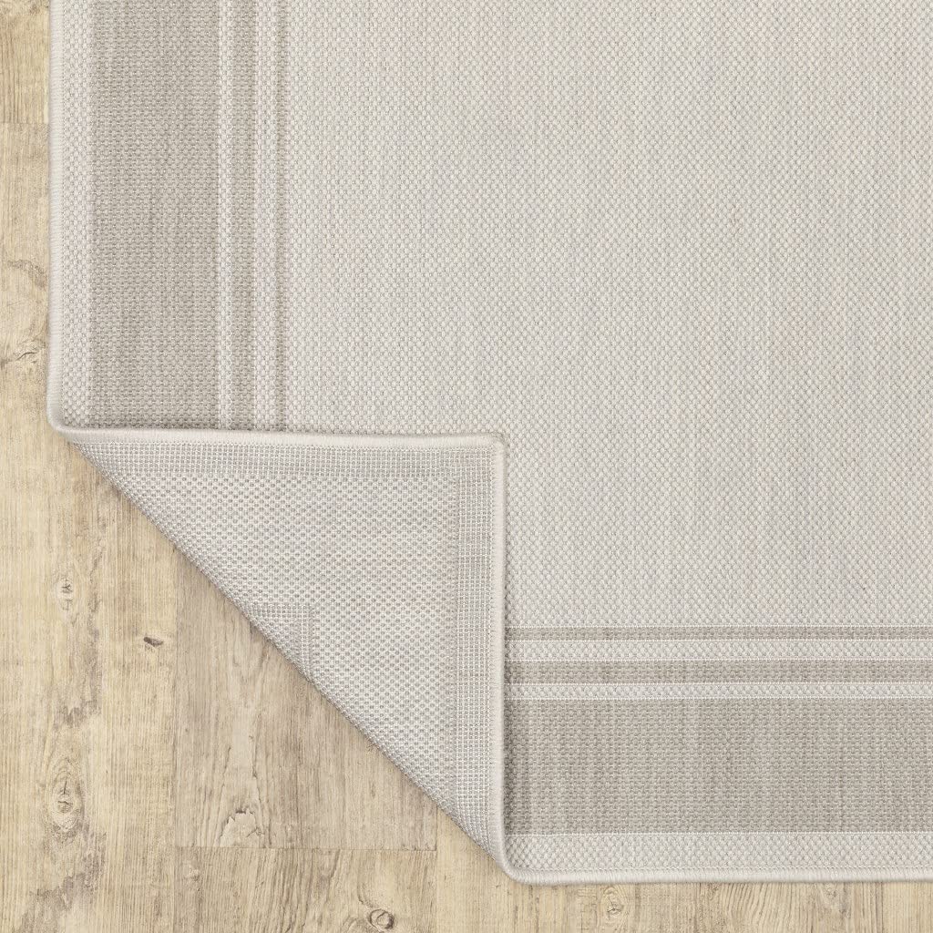 HomeRoots Polypropylene 8’x10’ Ivory and Gray Bordered Indoor Outdoor Area Rug