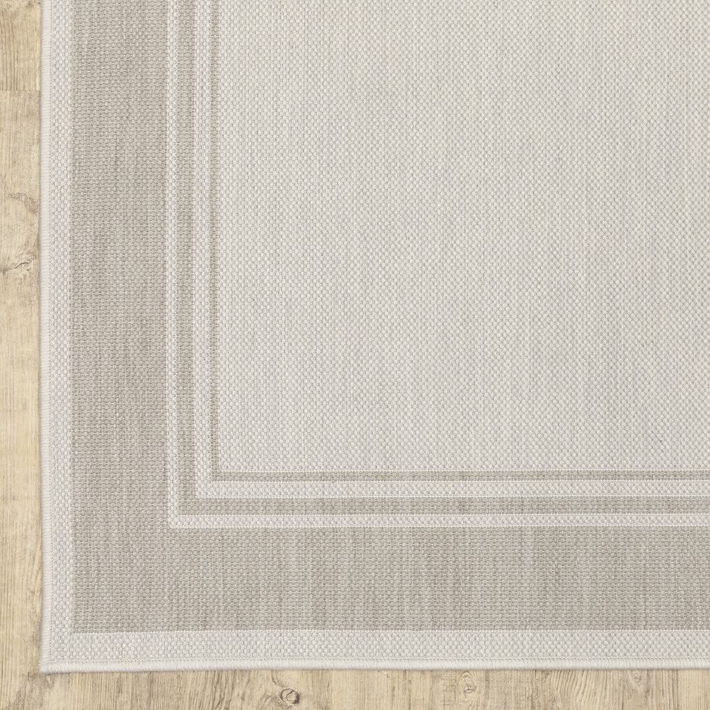 HomeRoots Polypropylene 8’x10’ Ivory and Gray Bordered Indoor Outdoor Area Rug