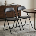 Set of Two Black Faux Leather and Steel Folding Chairs