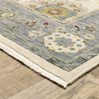 HomeRoots 509357 8 x 11 ft. Ivory Blue Gray Teal Gold Green & Rust Oriental Power Loom Stain Resistant Rectangle Area Rug with Fringe