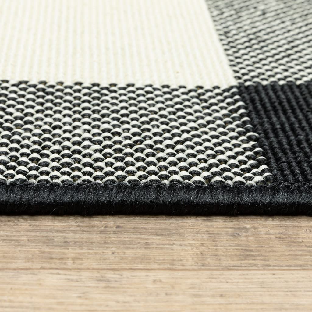 HomeRoots Polypropylene 5’x8’ Black and Ivory Gingham Indoor Outdoor Area Rug
