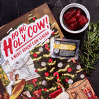 Man Crates Jerky Advent Calendar 2024 - 25 Beef Jerky Bites in Red with "Ho-Ho-Holy Cow" Artwork - Flavors: Orange Habanero, Rootbeer